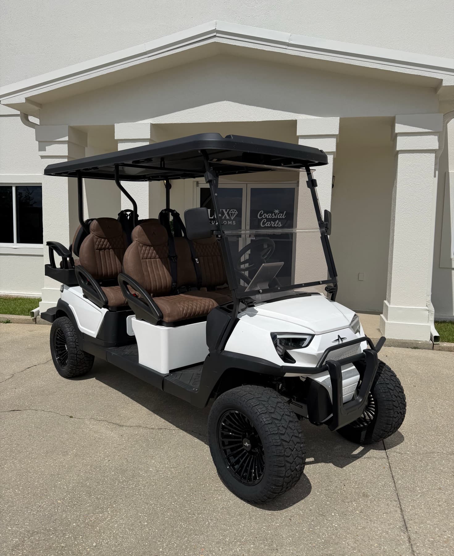 Pearl white six-passenger Atlas golf cart at Coastal Carts